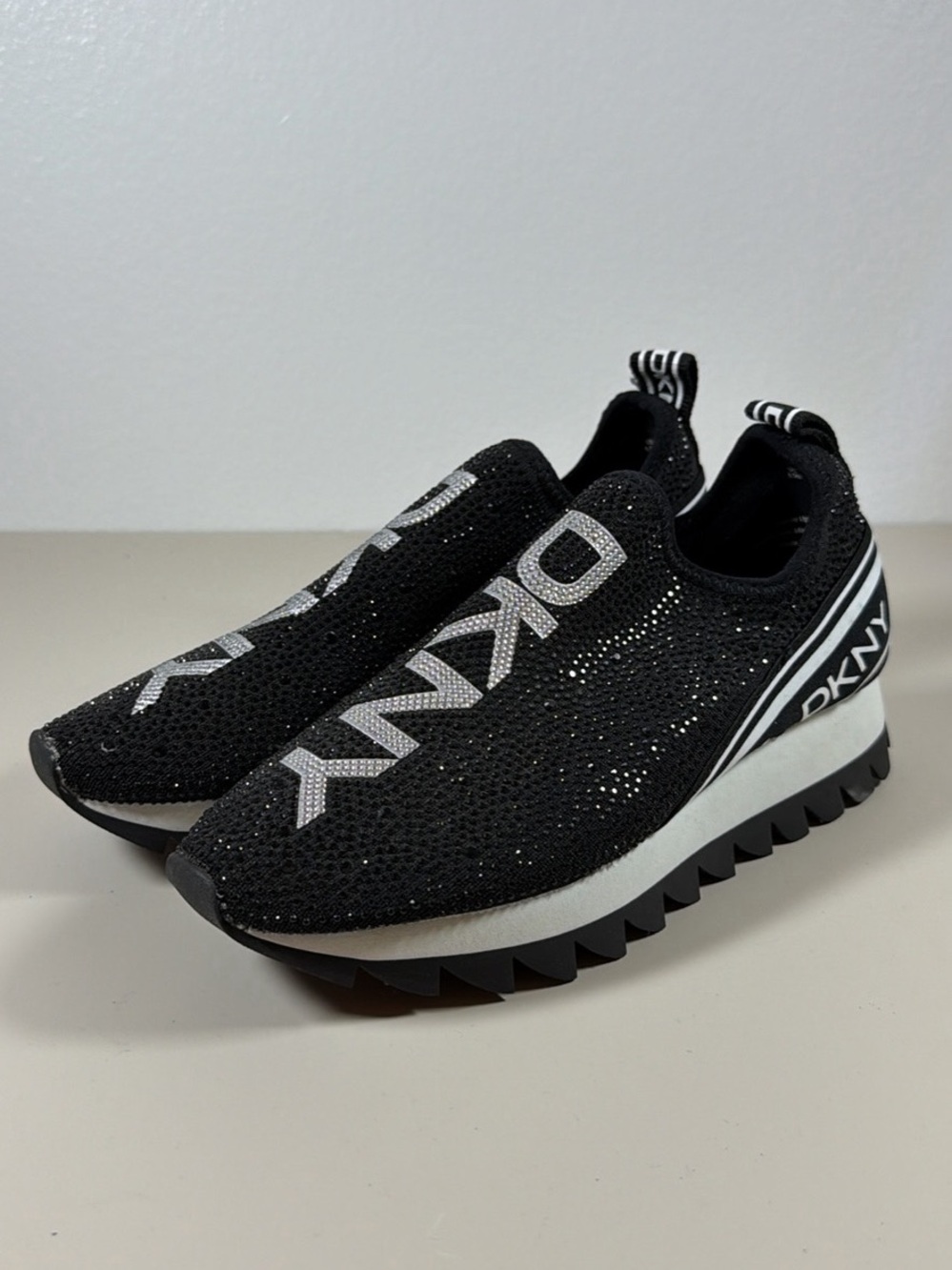 DKNY Black Knit Slip-On Sneakers with Silver Logo